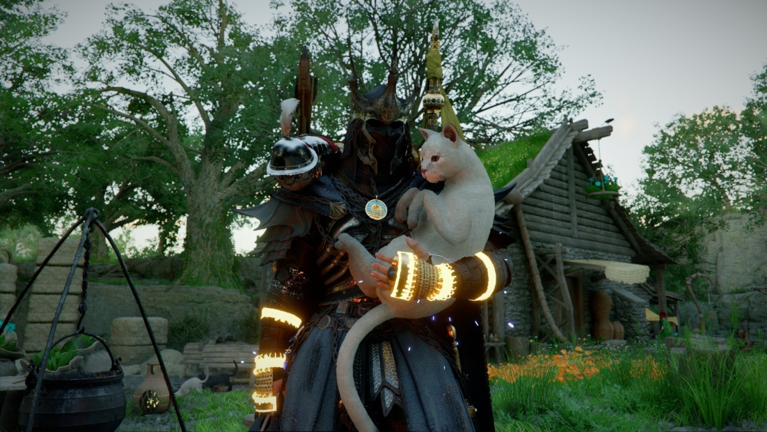 Person in dark armor with glowing arm bands holding a white cat in a rural setting with trees and a wooden cabin