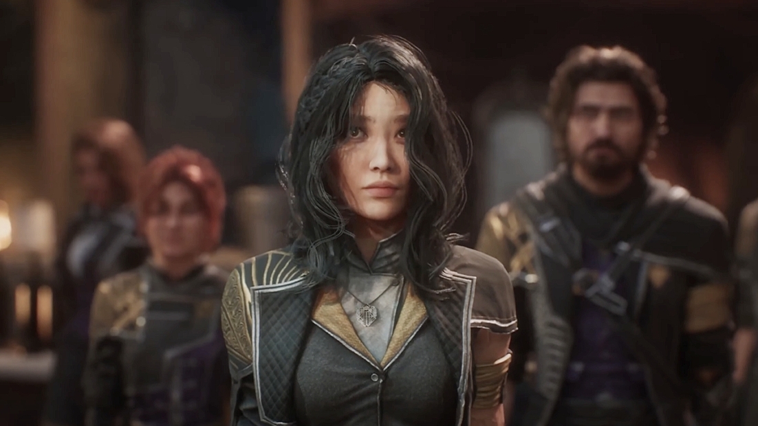Lune Build: Eine Gruppe von vier Personen steht in einem Raum. Die Person im Vordergrund trägt ein graues Outfit mit goldenen und lila Akzenten. Die anderen Personen im Hintergrund haben rote und dunkle Haare und tragen ebenfalls dunkle Kleidung.