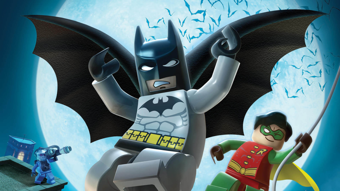 LEGO Batman figure with outstretched wings and raised arms against a blue background with bats, next to a small LEGO figure holding a camera and another LEGO figure in a red costume.