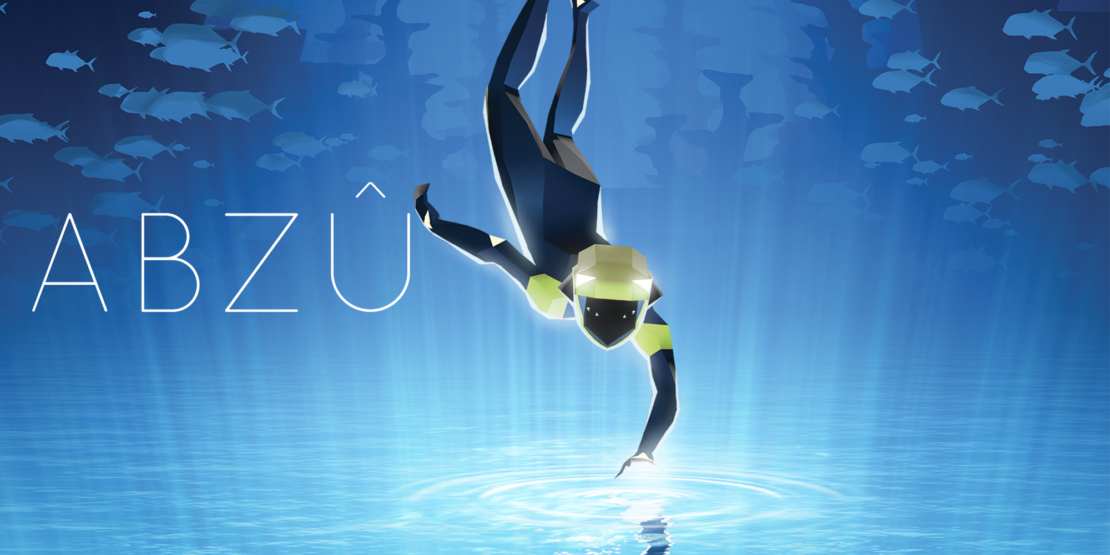 Diver in black wetsuit with yellow accents swimming underwater in front of a school of fish