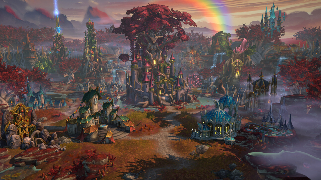 Fantasy landscape with a central castle, multiple towers, a rainbow, and numerous buildings in an autumnal setting