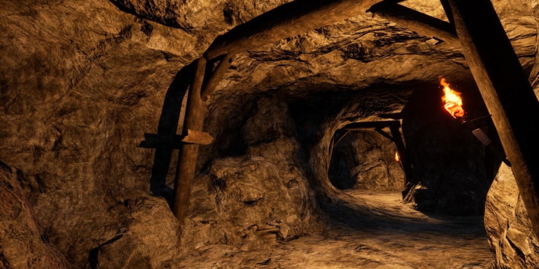 tunnel in a mine lit by a torch