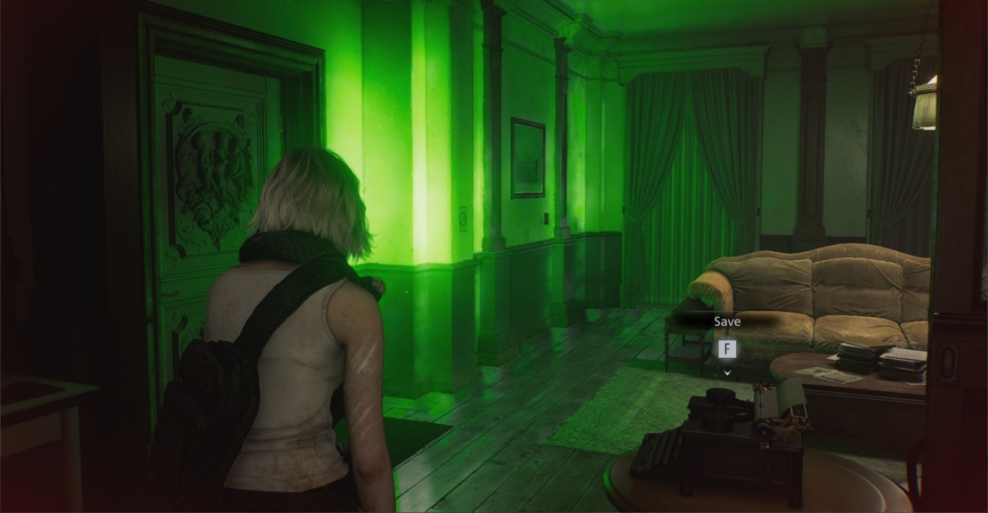 Woman with backpack standing in a dark room illuminated by green light near a sofa