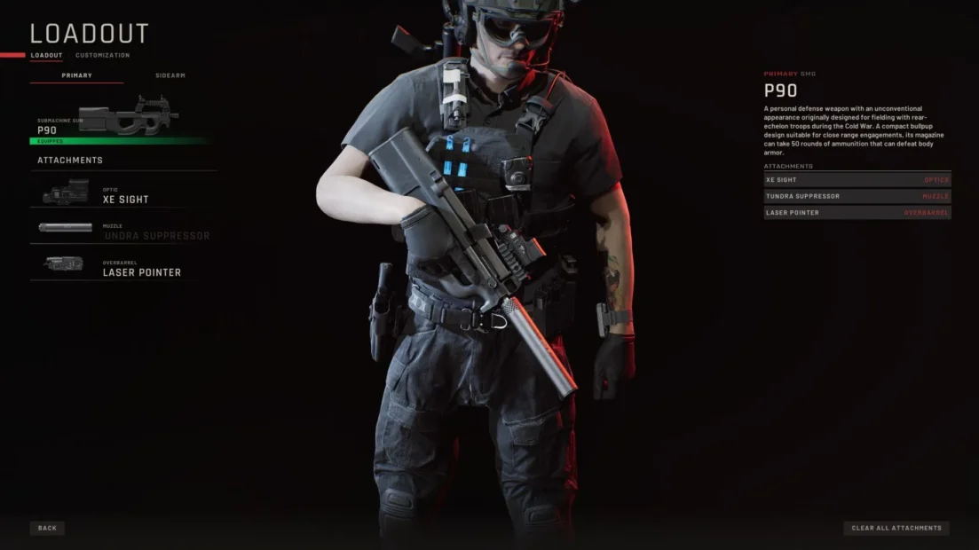 Person in tactical gear holding a P90 submachine gun equipped with XE sight, underbarrel suppressor, and laser pointer.