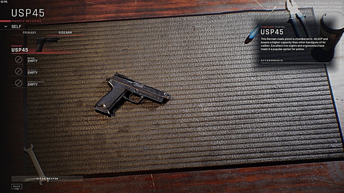 Black USP45 pistol lies on a black textured mat on a wooden table, next to a wrench and a screen showing text information about the USP45 from the game Ready or Not.