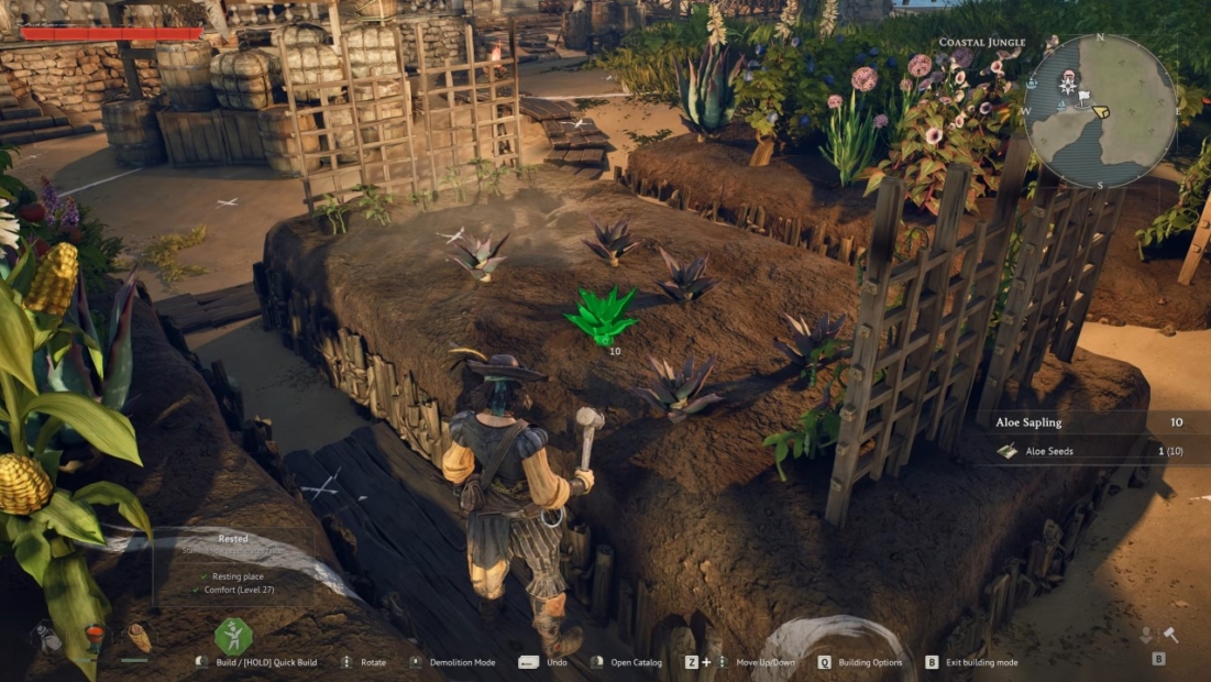 Windrose Farming Guide: View of a rectangular raised garden bed with several small plants and a lattice on the side in a game environment.