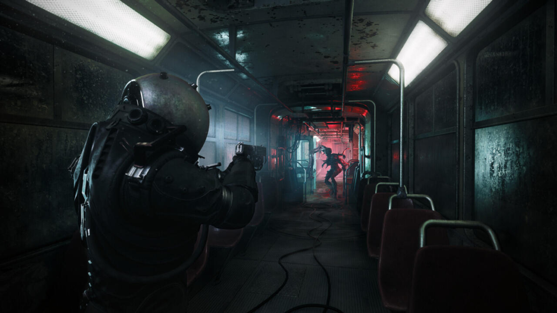 A dark, abandoned subway car from 'Cronos: The New Dawn'. A figure in a bulky, armored suit aims a gun at a shadowy creature in the distance. Red and blue lights illuminate the scene.
