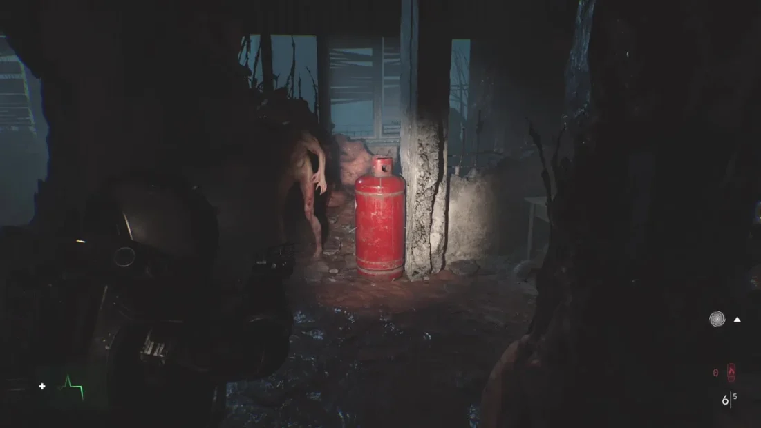 A character from 'Cronos: The New Dawn' stands near a red gas canister in a dimly lit, eerie environment with dark, organic shapes in the background.