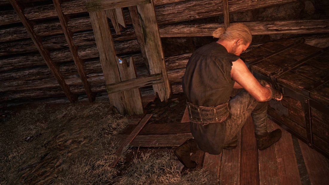 Gothic 1 Remake Lockpicking: A man with a blond braid kneels in a dark wooden attic picking a lock