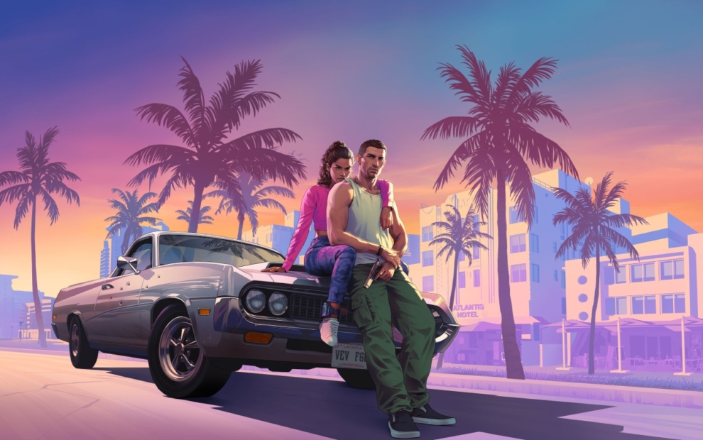 Two people lean against the hood of a classic car in front of palm trees and buildings at sunset.