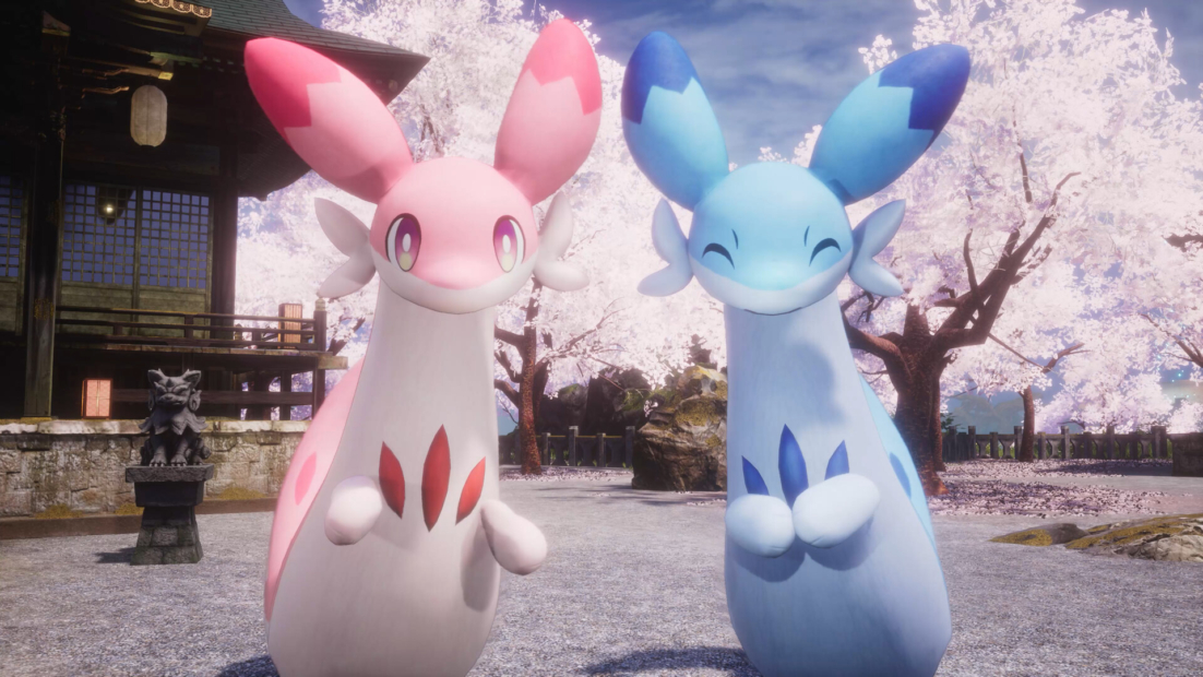 Two fantasy creatures with long necks, large ears, and fins, one pink and one blue, standing in front of a traditional Japanese building and blooming cherry trees