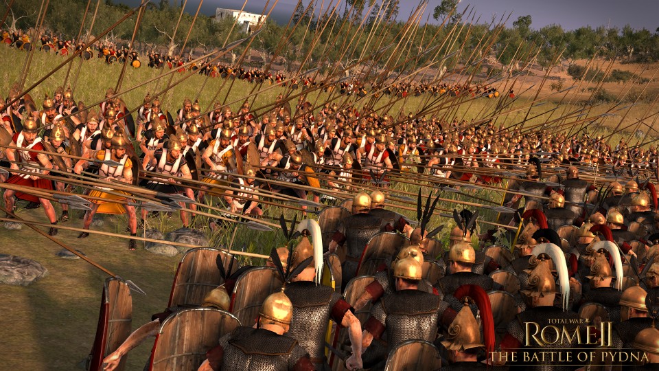 Ancient soldiers in armor with helmets and long spears in open landscape, viewed from behind in formation.