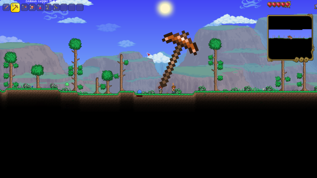 Pixelated Terraria game scene with a large diagonal pickaxe in the center and several trees on a grassy area in front of mountains and blue sky.