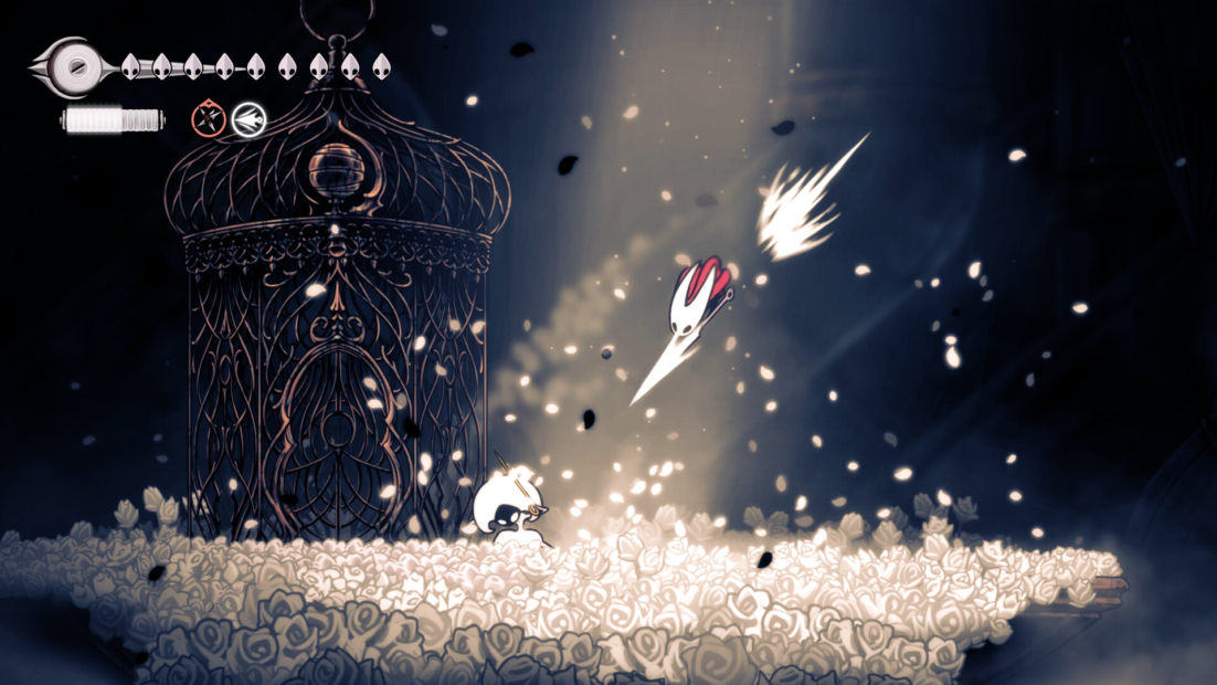 A character with a white body and black head jumps on a flower-covered surface. In the background, an ornate cage stands. A projectile flies upward.