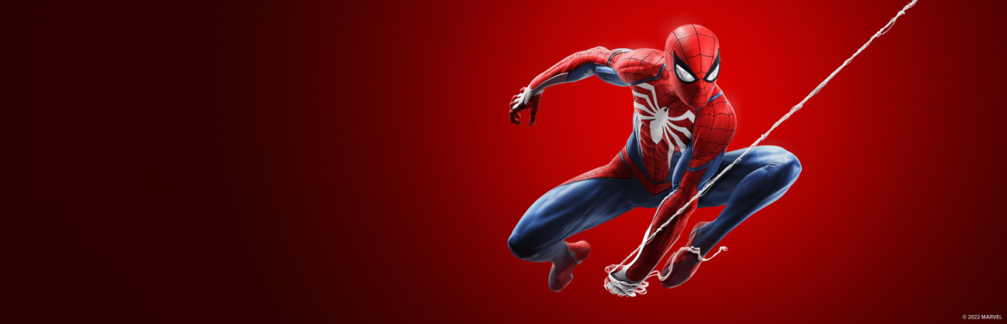 Spiderman in a dynamic leap with white spider symbol on red suit against red background