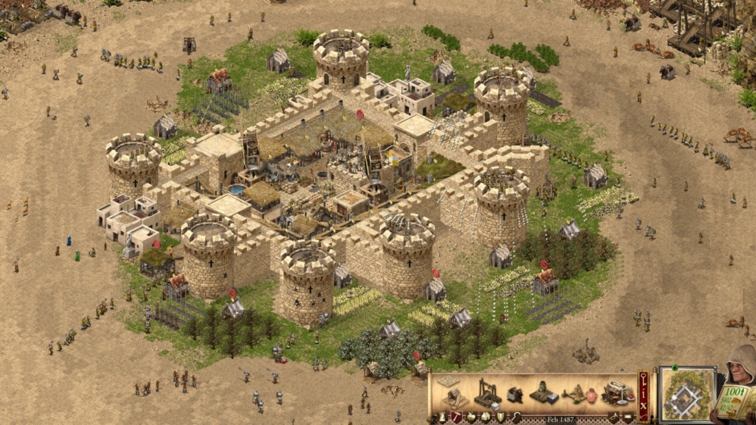 Medieval stone castle with six round towers and battlements surrounded by soldiers and siege equipment in Stronghold Crusader: Definitive Edition game.