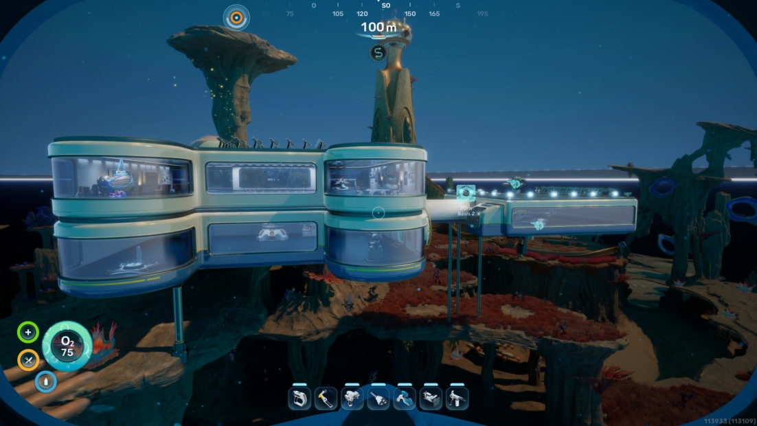 Modern underwater base with multiple connected modules and illuminated windows in a marine landscape with rocks and plants.