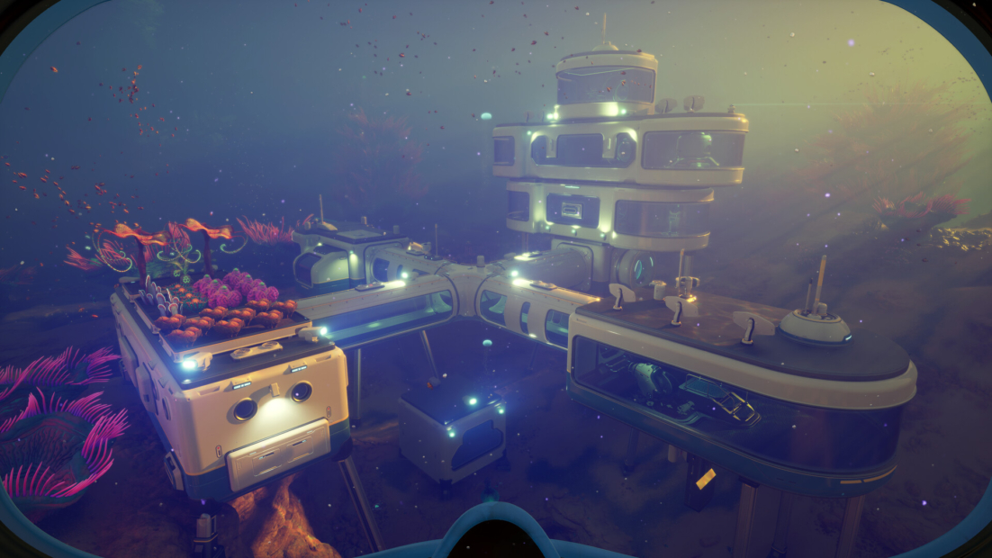 Subnautica 2 Tips: Underwater base with multiple connected modules and glowing elements viewed through a diving mask