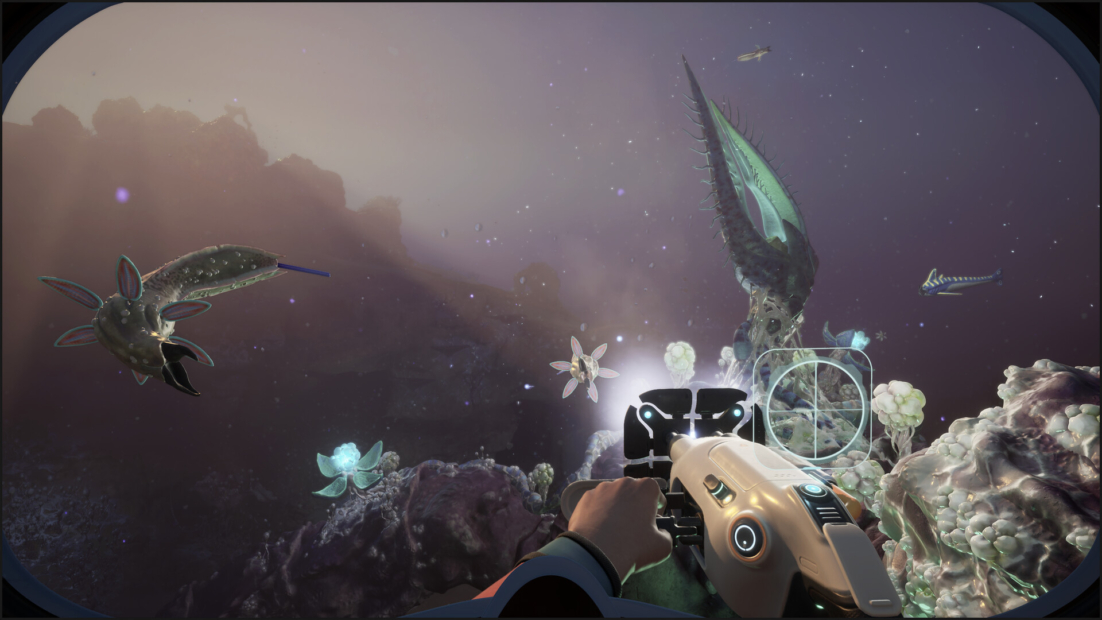 Underwater scene with various alien sea creatures and a hand holding a futuristic scanning device
