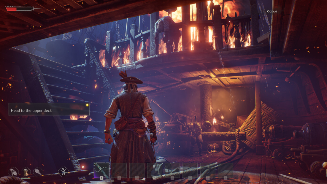 Figure wearing a wide-brimmed hat stands inside a dark ship hull illuminated by fire with visible wooden beams and equipment